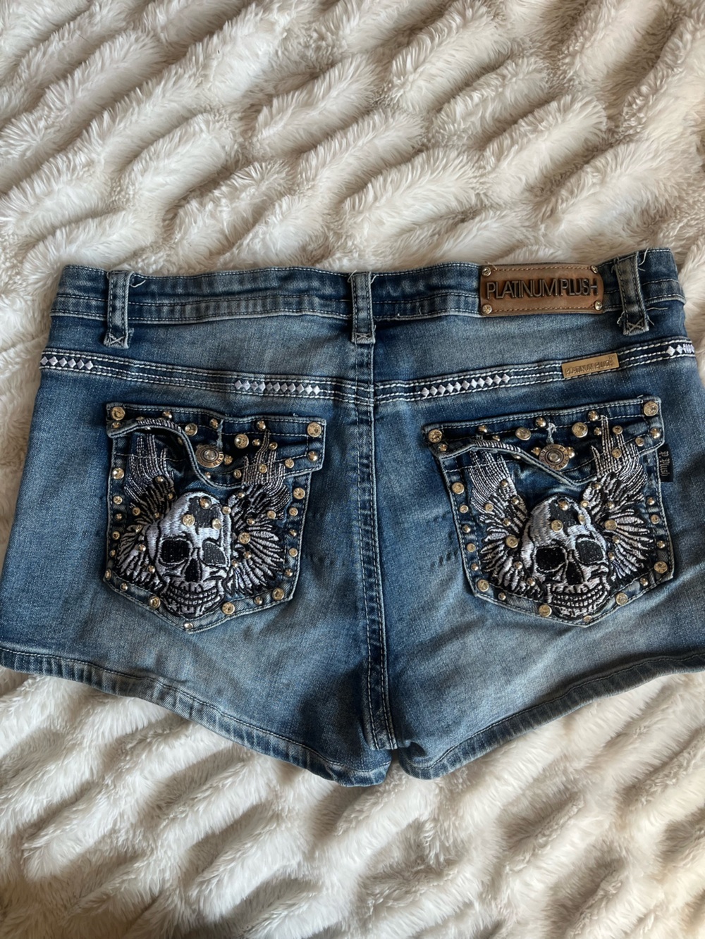 Platinum Plush Bedazzled Jean shorts with skull decal